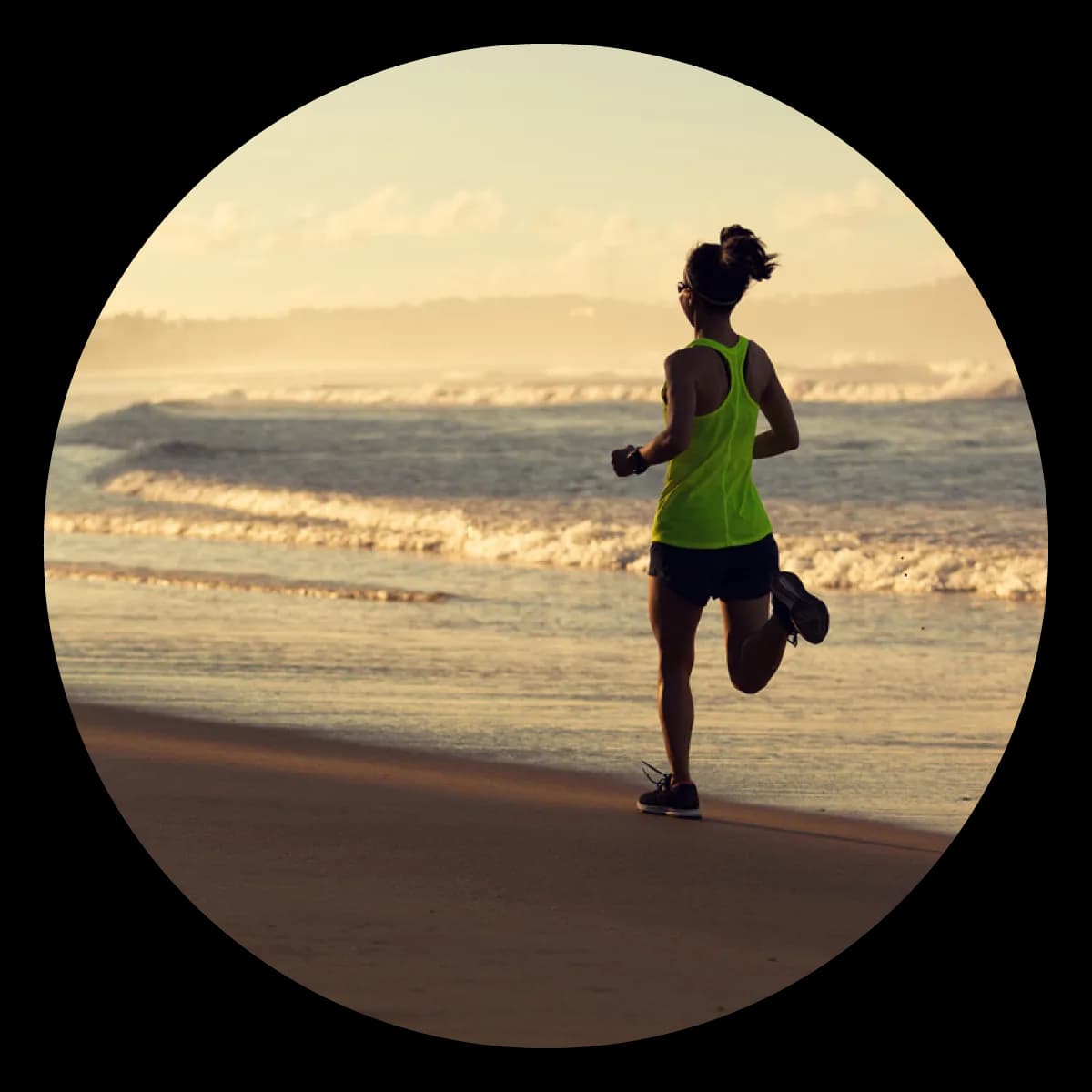 Woman running along the beach