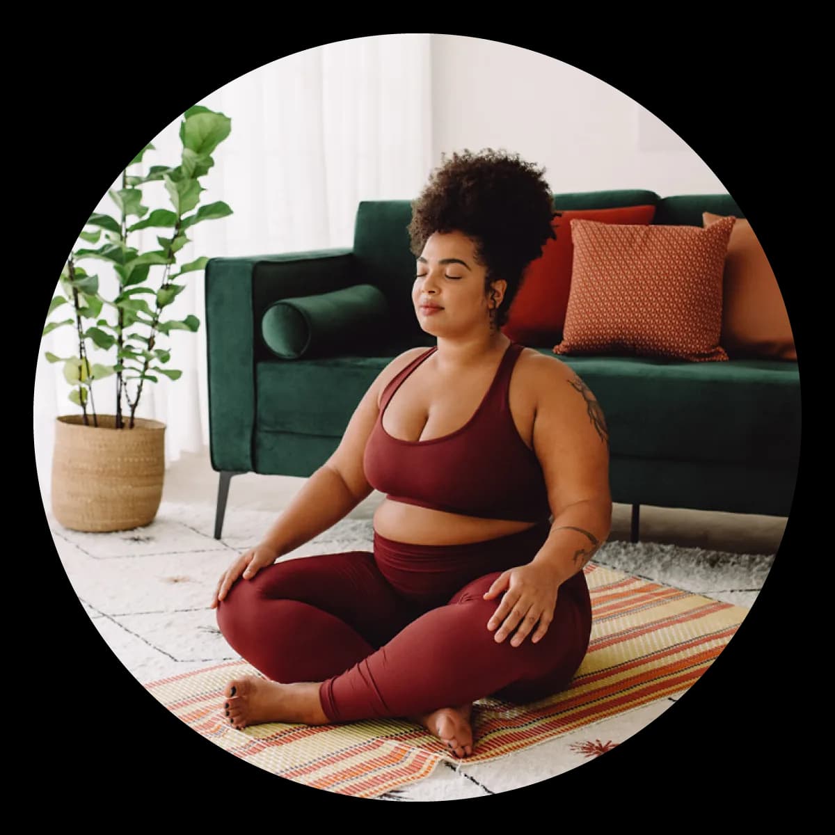 Woman meditating on floor at home