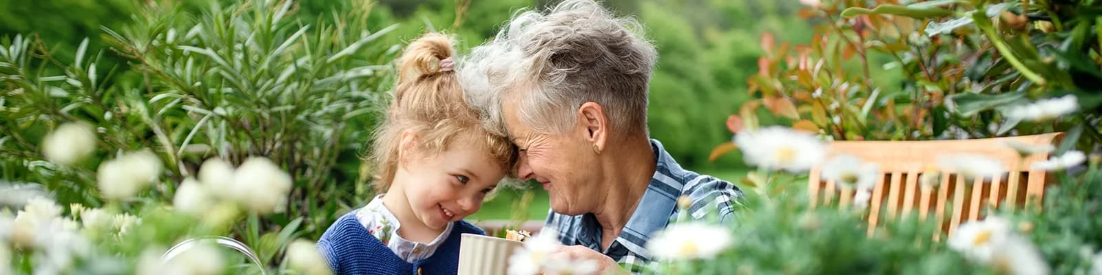 Grandmother and granddaughter gardening