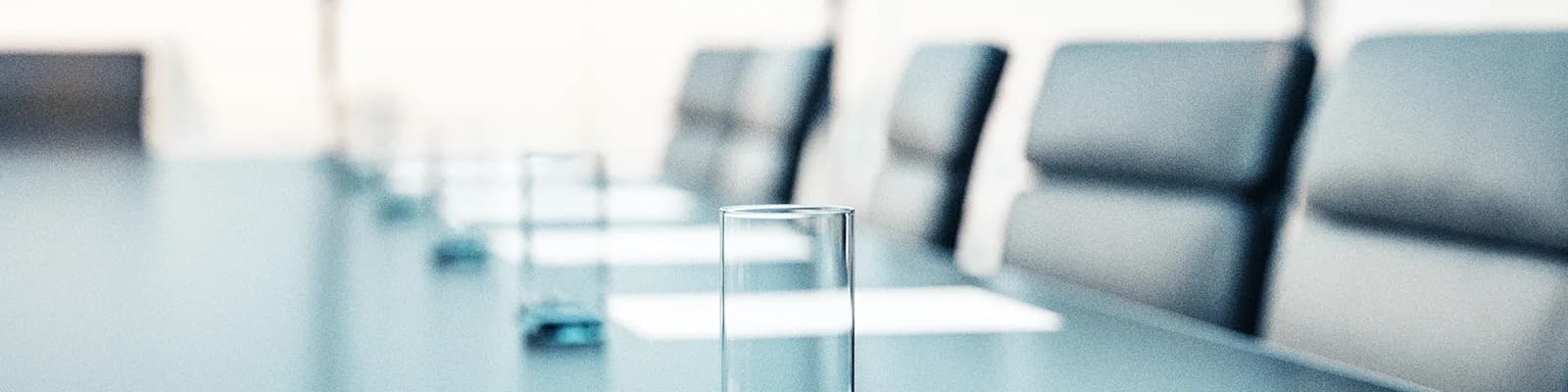 Blurred office meeting room with conference chairs and table